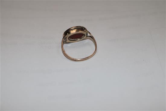 A Georgian gold and carnelian set signet ring, size J.